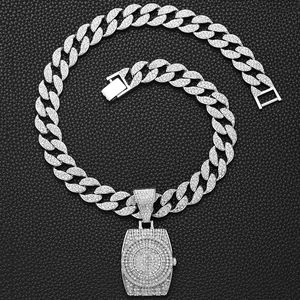 Macro view of silver Cuban chain necklace with a full iced-out watch-shaped pendant