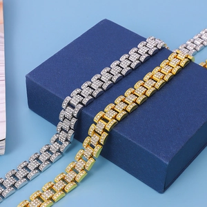 Close-up of gold and silver President link bracelets encrusted with sparkling diamonds