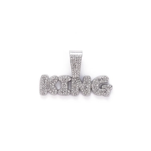 Hip hop silver-toned KING letter pendant with micro-pave rhinestones on a white background