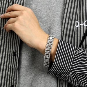 Iced out silver Cuban link chain bracelet for men featuring a luxury watch buckle design