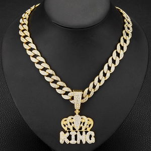 Hip hop gold Cuban chain necklace featuring a luxury iced-out crown KING pendant on mannequin