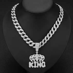 Hip-hop silver Cuban chain with iced-out KING crown pendant and sparkling rhinestones