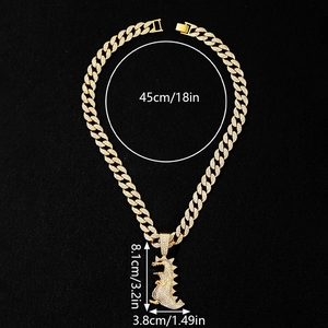 Detailed size view of hip hop gold plated dinosaur pendant on iced out cuban chain