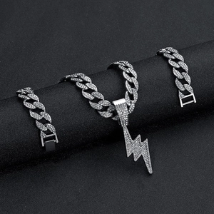 Silver iced-out cuban link chain and bracelet set with lightning bolt pendant