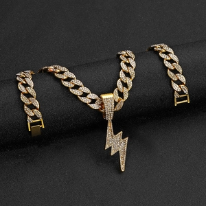 Iced out gold lightning bolt pendant on chunky cuban link chain for hip hop street fashion