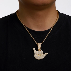 Hip hop gold shaka gesture pendant necklace with white crystals on twisted rope chain