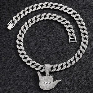 Hip hop silver Cuban link necklace with iced out shaka hand pendant on black leather