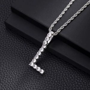 Close-up of silver letter L pendant with pavé cubic zirconia on twist rope chain