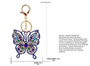 Vue détaillée du porte-clés papillon avec cristaux bleus montrant la longueur de 13,2cm