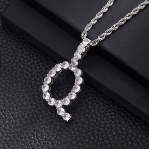 Macro detail of silver letter P pendant necklace with sparkling cubic zirconia inlay