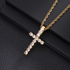Close-up of hip hop gold rope chain with a cross pendant encrusted in round zircon stones