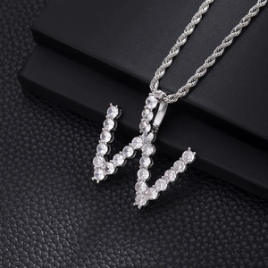 Detail of silver-plated 'W' letter pendant with sparkling cubic zirconia on a rope chain