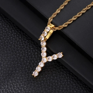 Close-up of a gold hip hop letter Y pendant paved with sparkling cubic zirconia on rope chain