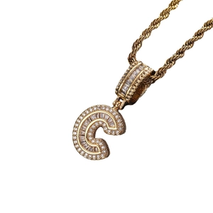 Hip hop gold necklace with iced out letter C pendant featuring pave set cubic zirconia