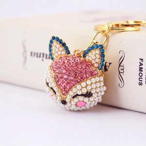 Porte-clés renard scintillant avec strass et perles sur bijou de sac doré élégant