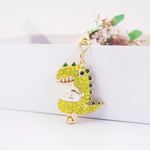 Sparkling rhinestone dinosaur keychain with golden metal lobster clasp and enamel belly
