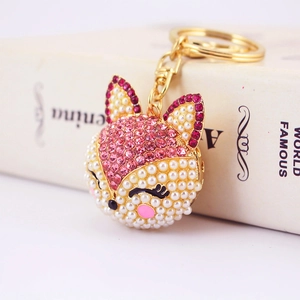Porte-clés renard étincelant en strass roses et perles sur chaîne dorée pour sacs