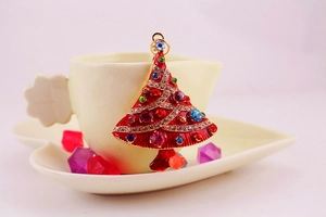 Detailed macro view of colorful rhinestone embedded Christmas tree keychain accessory