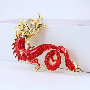 Exquisite red and gold dragon keychain with crystal details on a white gift box