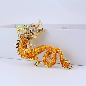 Exquisite golden flying dragon keychain with orange enamel and sparkling rhinestones