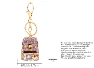 Detailed view of rhinestone backpack keychain with heart charm and zinc alloy materials