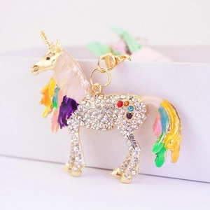 Colorful crystal encrusted unicorn keychain with vibrant enamel wings and gold plating