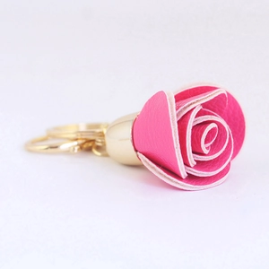 Rose flower keychain in rose red leather with a golden metal ring for bags or cars