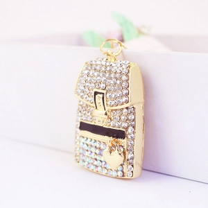 Golden mini backpack keychain with sparkling white and AB rhinestones and a heart charm