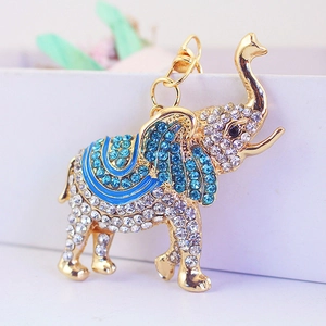 Porte-clés éléphant étincelant avec strass et détails en émail bleu sur métal doré