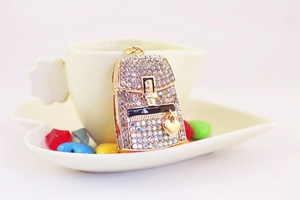 Close-up of a heart backpack keychain with sparkling rhinestones and gold plating