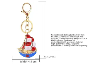Macro shot of gold dragon boat keychain with rhinestones and smooth enamel finish