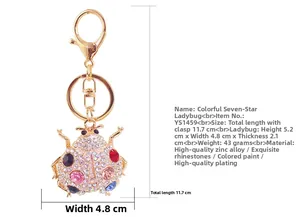 Detailed view of rhinestone ladybug keychain showing specific dimensions and metal texture