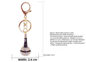 Detailed view of a black and gold microphone keychain with sparkling rhinestones and measurements