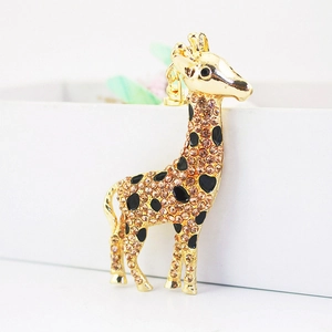 Cute giraffe keychain with champagne rhinestones and black enamel on gold metal base