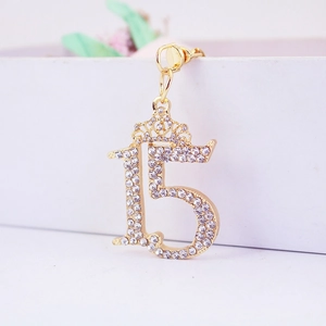 Sparkling number 15 keychain with rhinestone crown and golden finish for bags
