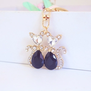 Cute double cat crystal keychain with gold metal finish and rhinestones for women