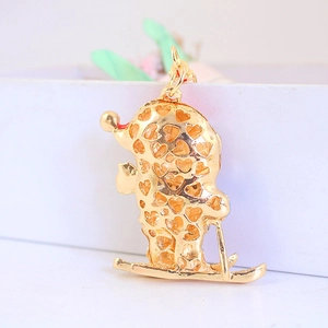 Creative gold-plated skier pendant with heart hollow-out detail for keychains and necklaces