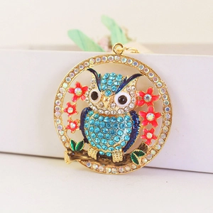 Sparkling crystal owl keychain with blue rhinestones and pink flowers on a golden ring