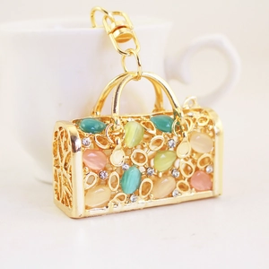 Golden handbag keychain with cat eye stones and sparkling crystals for women