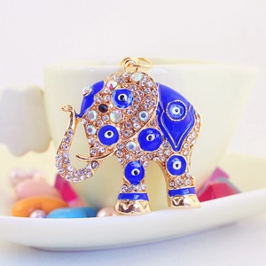 Cute golden elephant keychain with blue enamel evil eye and sparkling rhinestones