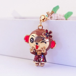 Cute enamel monkey keychain pendant with flower detail in a premium white gift box