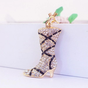 Elegant rhinestone studded boot keychain in gold alloy with black enamel details