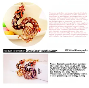 Detail of snake keychain featuring gold rhinestone and purple enamel on zinc alloy