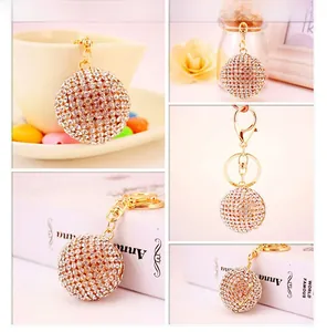 Detailed view of sparkling crystal ball keychain with gold lobster clasp and ring