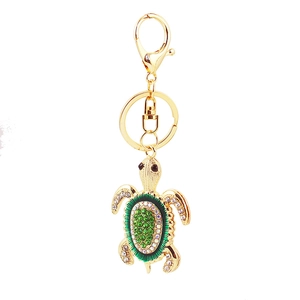 Porte-clés tortue de mer étincelant avec strass verts et fermoir mousqueton doré brillant