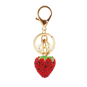 Cute strawberry keychain with red rhinestones, gold plating and faux pearl accents