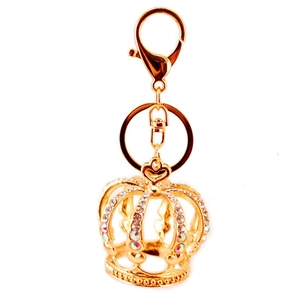 Golden crown keychain with sparkling rhinestones and lobster clasp on white background