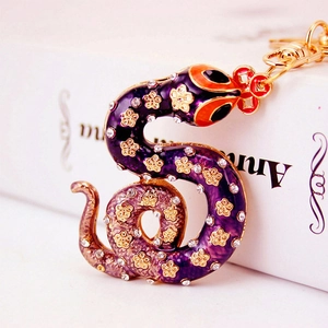 Sparkling rhinestone zodiac snake keychain with purple enamel finish and golden clip