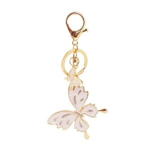 Cute golden butterfly keychain with white enamel and sparkling rhinestones for handbags