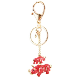 Porte-clés rhinocéros créatif en émail rouge avec strass brillants et métal doré
